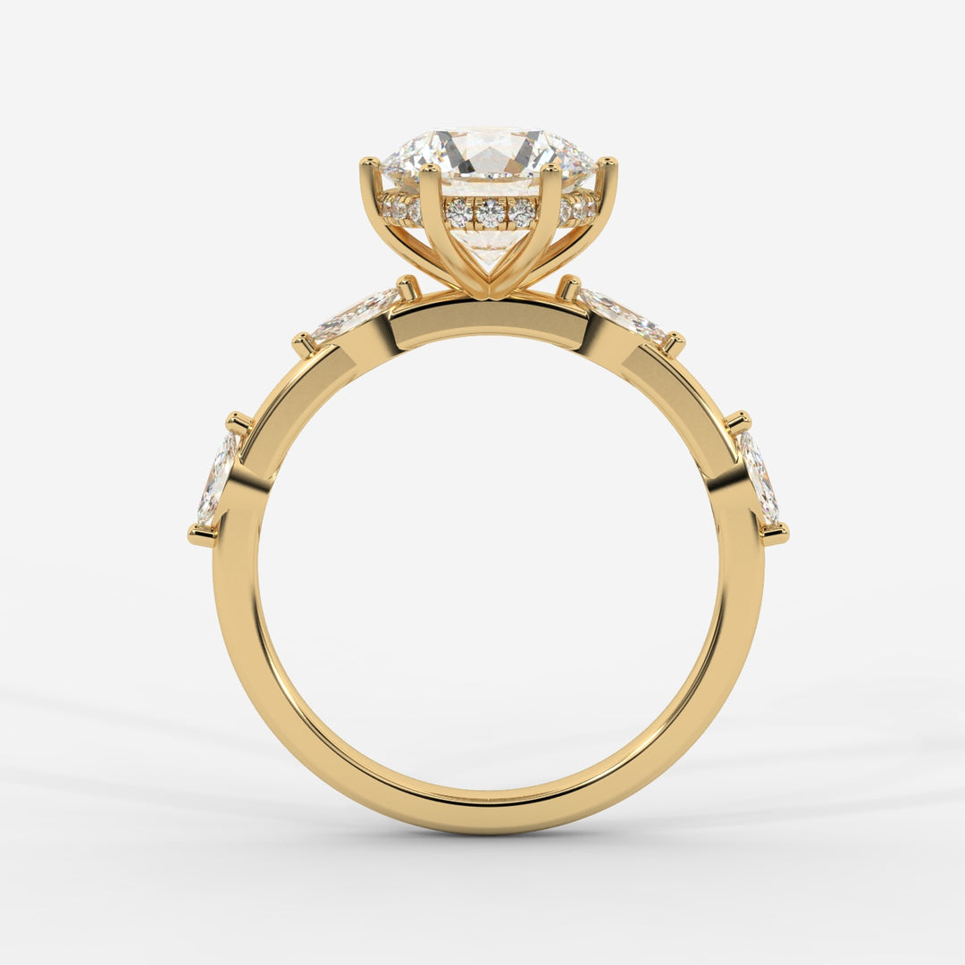 A profile view of a gold ring highlighting the prong-set round lab-grown diamond with marquise-cut lab-grown side diamonds and a hidden halo.