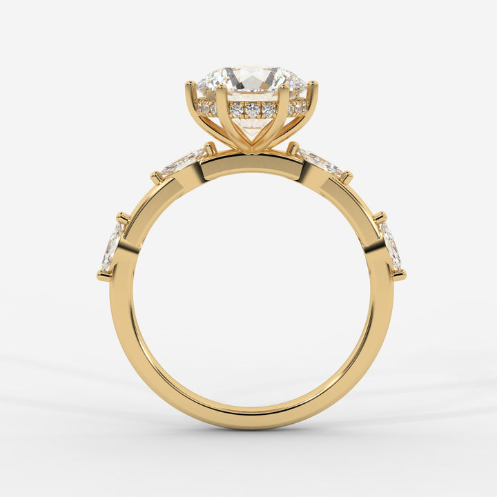 A profile view of a gold ring highlighting the prong-set round lab-grown diamond with marquise-cut lab-grown side diamonds and a hidden halo.