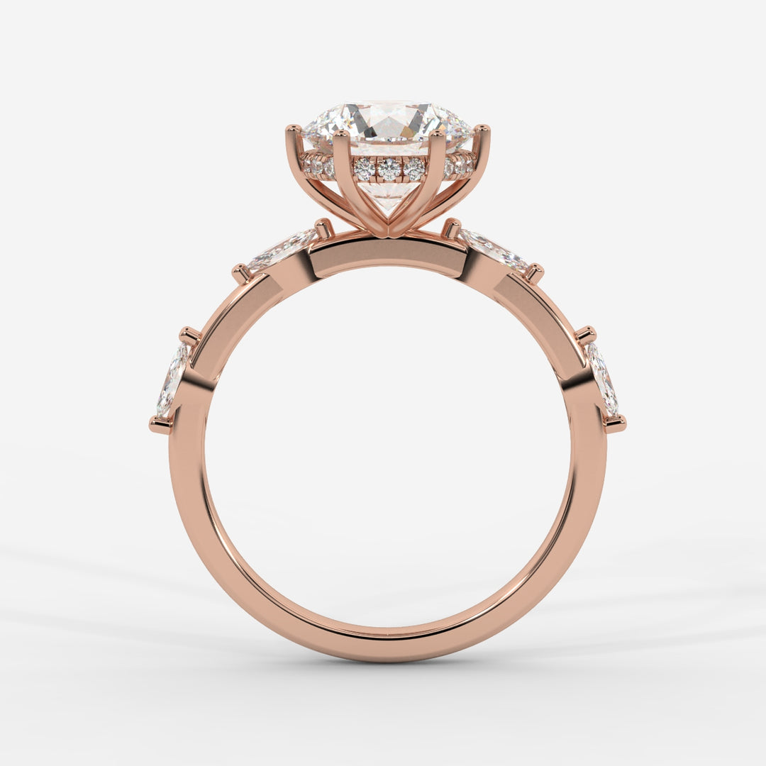 A profile view of a rose gold ring highlighting the prong-set round lab-grown diamond with marquise-cut lab-grown side diamonds and a hidden halo.